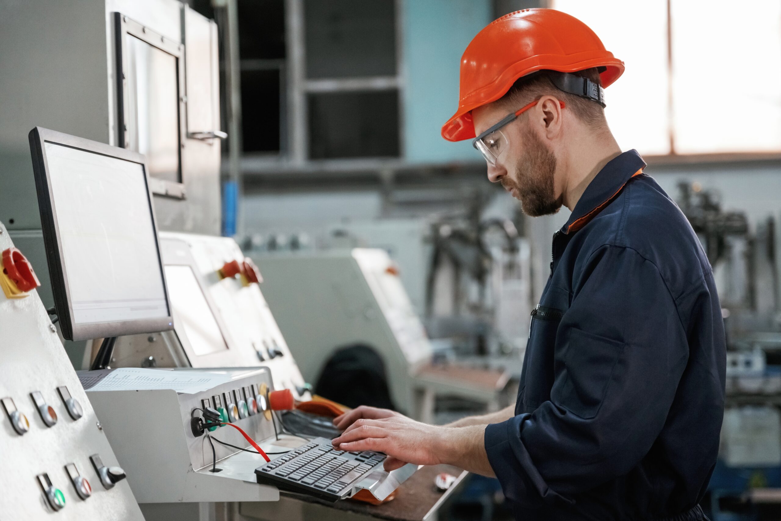 Operating,The,Machine.,Factory,Worker,Is,Indoors,With,Hard,Hat